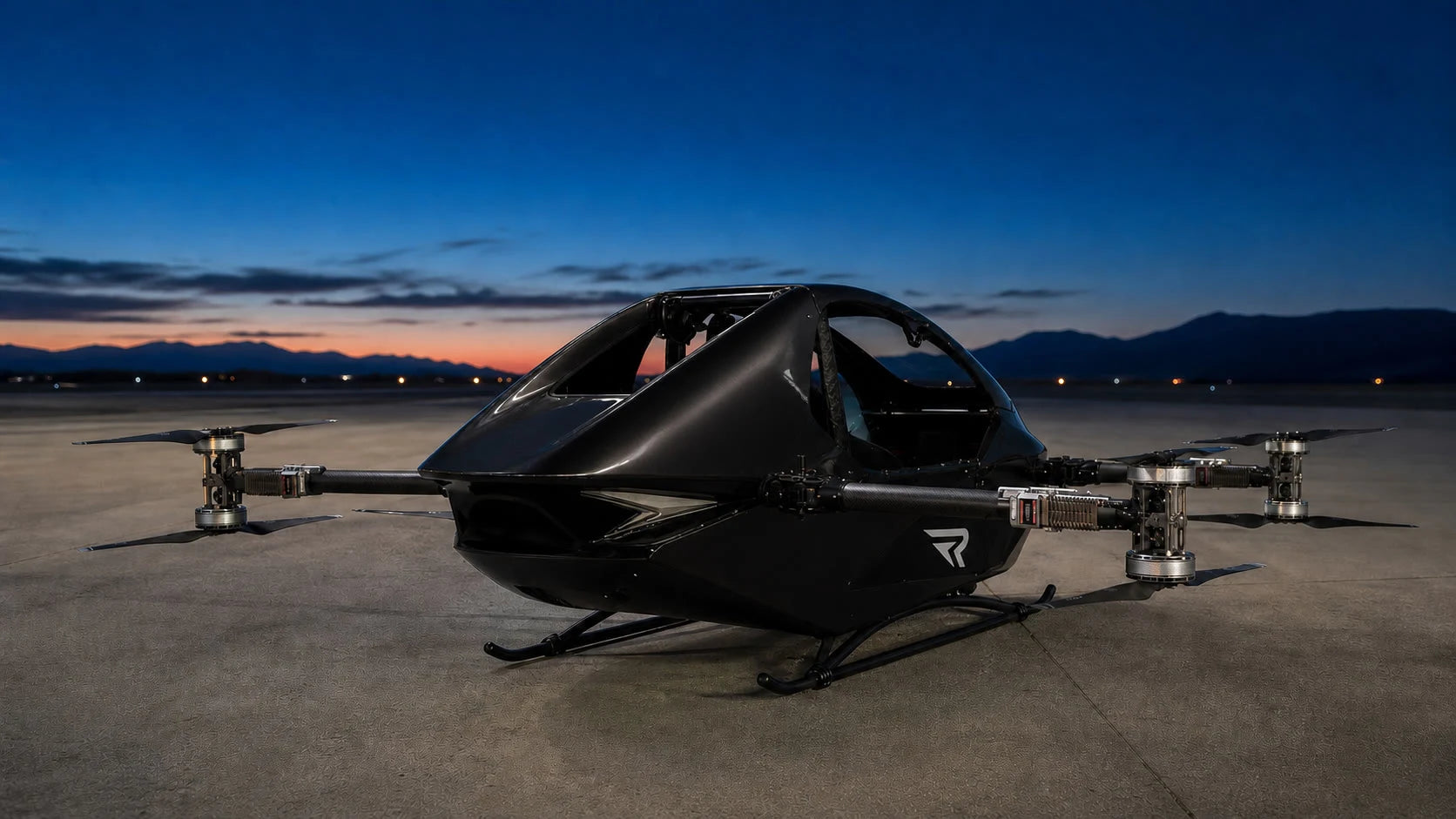 Black REVTOL aircraft at the hangar